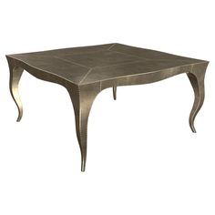 a table that is made out of metal and has curves on the top, as well as