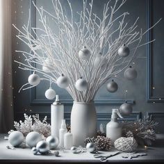 a white vase filled with lots of ornaments on top of a table covered in snow