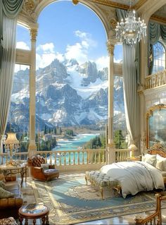 a large bedroom with a view of the mountains and lake through an arched window that leads to a balcony