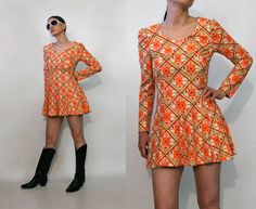 "vintage '70s tangerine & cream flirty geo mini dress check / harlequin geo pattern puffed shoulders fit 'n' flare / skater shape zips up the back unlined DETAILS-----> Era: '70s Fabric: MEASUREMENTS-----> Tag: n/a - no size marked; should fit a modern xs - small **has a bit of stretch - about 1\" Shoulders: 14.25\" Bust: 16.25\" Sleeves: 23.5\" Sleeves (from underarm): 17.25\" Waist: 14\" Hips: free Length: 30.25\" CONDITION-----> In excellent vintage condition. No flaws to note. MODEL SPECS--- 70s Mini Dress Cocktail, 70s Twist Front Dress, 70s Cutout Dress, V Neck 70s Dress, Cheap Retro Mini Dress, 1970 Short Dress, 70’s Dresses, 70s Mini Dress, 70's Dress