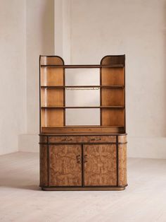 an art deco bookcase with mirrored doors and drawers