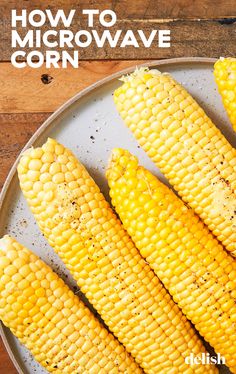 grilled corn on the cob in a white plate with text overlay how to microwave corn