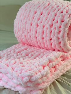 two pink towels folded on top of each other