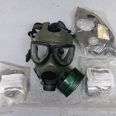 a gas mask with goggles and other items