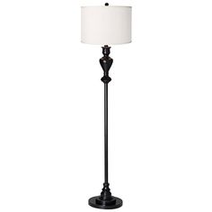 a black floor lamp with a white shade