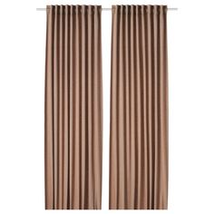 a pair of curtains with brown pleated drapes