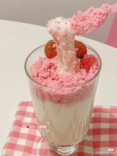 a dessert in a glass on top of a table