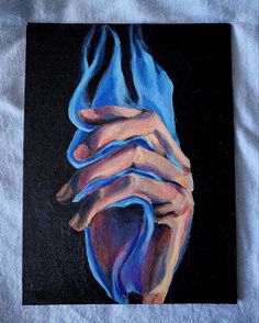 a painting of two hands holding each other with blue flames coming out of them on a black background