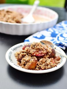 a close up of a plate of food on a table with other dishes in the background