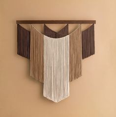 a wall hanging with fringes on it