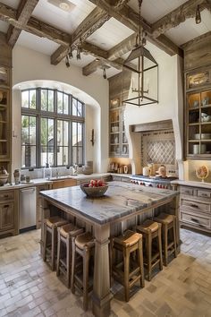 Spacious rustic country kitchen with large island and beam ceilings, perfect for gatherings. Modern Hacienda Kitchen, Rustic Modern Kitchen Ideas, Hacienda Kitchen, Modern Kitchen Ideas, Rustic Kitchen Island, Farmhouse Kitchen Island, Modern Rustic Decor, Rustic Modern Kitchen