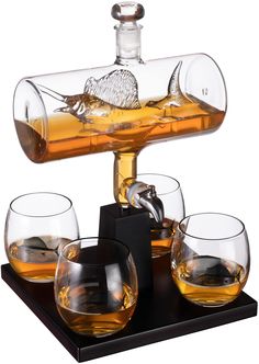 PRICES MAY VARY. SAIL FISH WHISKEY DECANTER SET - Store spirits with sophistication & class as you pay homage to the thrill of fishing and the nautical lifestyle. Includes four glasses and a mahogany base for impressive mounting and display. Perfect for the captain's quarters. CALLING ALL MEN OF THE REEL - Our stunning whiskey decanter makes a unique gift for any guy who loves fishing or enjoys time out on the open water. Cast your line and reel in the good times. Make a splash in the evenings w Sail Fish, Captain's Quarters, Great Gifts For Guys, Wine Decanter Set, Glass Decanter Set, Whisky Decanter, Liquor Dispenser, Liquor Glasses