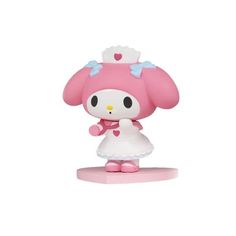 a hello kitty figurine is standing on a pink base