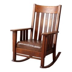 a wooden rocking chair with brown leather seat