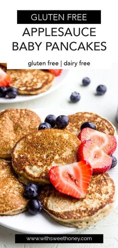 pancakes topped with strawberries and blueberries on top of a white plate text reads gluten free applesauce baby pancakes