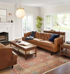 a living room filled with furniture and a fire place