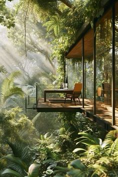 a house in the middle of some trees and plants with a table on top of it