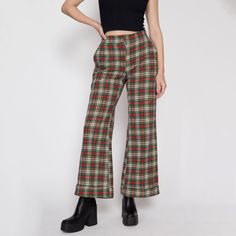 Vintage early 70s red & green plaid knit pants with a high waist, a cuffed flared leg, and a zipper and snap at the waist for closure. Perfect for the holiday season!  Measurements and Condition: Fits like: Women's small to medium (they have been altered at the waist but it is possible to redo it) Fabric: Feels like acrylic Brand: None Condition: Very good, with light general wear, some light pilling to the back inner thighs, and they were taken in at the waist by a previous owner (see close up 70s Inspired Wide Leg Bottoms For Fall, Retro High-waisted Pants For Fall, 70s Inspired Wide Leg Fall Bottoms, 70s Inspired Full Length Bottoms For Fall, Fitted Vintage Wide Leg Pants For Fall, Retro Fitted Winter Bottoms, Retro Fitted Bottoms For Winter, Retro Wide Leg Bottoms For Fall, Plaid Full Length Pants For Fall