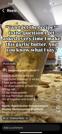 someone is pouring something into a cup on top of some food in front of the camera