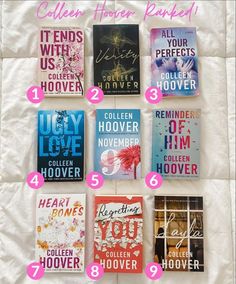 twelve books are arranged on a bed with pink and blue lettering in each bookmark