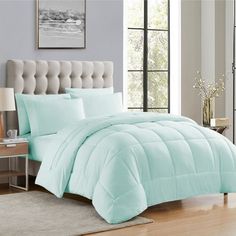 the comforter is light blue in this bedroom