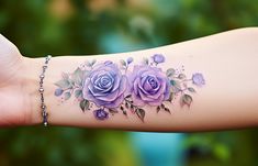 a woman's arm with purple roses on it