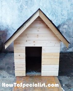 a small dog house made out of wood