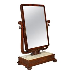 a wooden mirror sitting on top of a stand