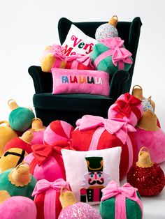 a pile of stuffed toys sitting on top of a white floor next to a chair