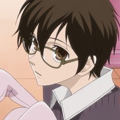 an anime character with glasses looking at something