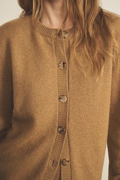 Our 100% cashmere Greta long-sleeve cardigan is the staple piece you need. Perfect for Layering your look and add a touch of something special. Wear it closed up to the top to play it preppy, or open for a more relaxed fit. Unisex and versatile as always, it allows you to express yourself and interpret it as you want, giving you the touch of elegance you need in every fit. Charlotte’s fashion tip: "I love how this piece follows my moods everyday ! When I’m playing the elegance card, I like to wear it on its own, closed, paired with a scarf. When I’m in the mood for a more casual outfit yet with the bit of sophistication I always like, but with the touch of sophistication I always crave for, I leave it open with a nice cashmere and silk top." A true staple piece! Cashmere Outerwear With Buttons For Fall, Long Sleeve Cashmere Outerwear With Button Closure, Brown Cashmere Cardigan With Buttons, Fall Cashmere Top With Buttons, Cozy Fine Knit Outerwear For Layering, Casual Brown Cashmere Cardigan, Fall Cashmere Tops With Button Closure, Cashmere Button Top For Fall, Cashmere Tops With Buttons For Fall