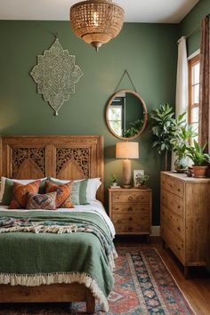 a bedroom with green walls and wooden furniture