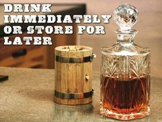 a bottle of liquor sitting next to a wooden barrel on a counter top with the words drink immediately or store for later