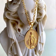 Miraculous Virgin Mary was a 1st century Galilean Jewish woman of Nazareth, and the wife of Joseph and the mother of Jesus. Your gold plated saint mary necklace looks very attractive and meaningful. Your blessed virgin mary necklace is double side and you can use both side to wear. Very special religious pendant gift for women and for men. Pendant Details: Nickel free hypoallergenic 22 carat gold plated You can use both side of the pendant (double side) We send your virgin mary necklace in a special gift pack Gender: Unisex Adult Pendant weight: 7-8 gram Pendant height: 1.80 inches (4.55cm) Pendant diameter: 0.98 inches (2.51cm) Pendant thickness: 0.080 inches (2mm) Chain type:  Box chain: 18 inches (45 cm): 8 gr 20 inches (50cm): 9,10 gr 24 inches (60cm): 10,9 gr Blessed Mother Necklace, Miraculous Medal Medallion Necklaces For Commemoration, Miraculous Medal Medallion Necklace For Commemoration, Spiritual Necklace With Miraculous Medal For Commemoration, Gold Virgin Mary Medallion Charm, Gold Virgin Mary Medallion Jewelry, Gold Virgin Mary Medallion, Gold Medallion With Virgin Mary, Spiritual Virgin Mary Medallion Jewelry