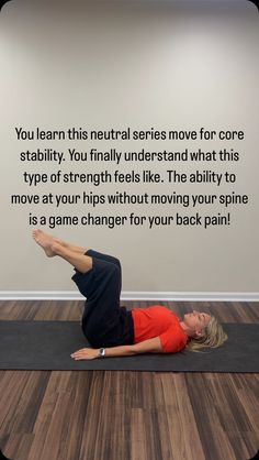 a woman is doing a yoga pose in front of a wall that says, you learn this