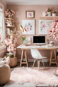 a home office with pink flowers on the wall