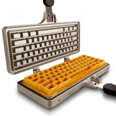 a waffle iron with an orange waffle on it