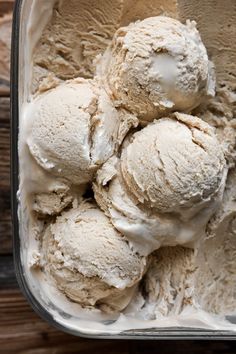 three scoops of ice cream in a glass container