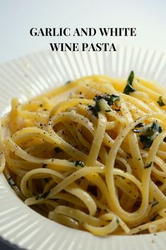 garlic and white wine pasta on a plate with the words garlic and white wine pasta