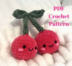 two crocheted cherries sitting on top of each other with the text, free pattern