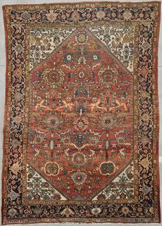 an antique persian rug with red and blue colors