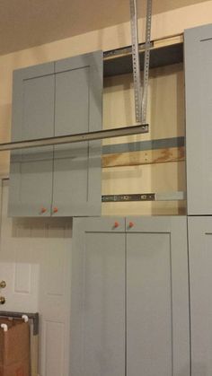 the kitchen cabinets are being installed in order to match the wall color and ceiling height