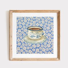 a painting of a coffee cup on a saucer with blue and white flowers in the background