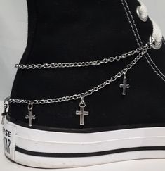 "This shoe or boot chain design features two chain strands with two styles of metal cross charms attached along the bottom chain. This design is available in Dark Silver (the chain is stainless steel). This listing is for 1 shoe (or boot) chain.  If you want chains for both shoes (or boots) you will need to order 2. There are 3 different ways to attach the chains to your shoe or boot. Below is the type of attachment and the length of each chain for that way. It is a good idea to measure your shoes or boots first to make sure the chain will fit. Jump Ring Ends to slip onto the laces - See picture 5. The length of the chain for this is 10 inches for shoes and 12 inches for boots or padded/thick high-tops. *The jump ring size for shoes are 8mm diameter and the jump ring size for boots are 10m Platform Boots With Chains, Edgy Leather Boots With Chain, Platform Boots Chains, Black Boots Chains, Boot Chains, High Top Shoe, Shoe Boot, Cross Chain, Metal Cross