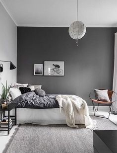 a bedroom with gray walls and white carpeted flooring is pictured in this image