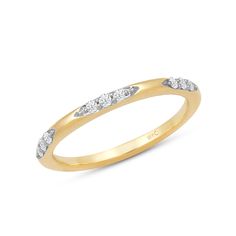 a yellow gold wedding band with three diamonds