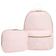 two pink backpacks sitting next to each other