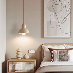 a bedroom with a bed, nightstands and artwork on the wall above it in neutral colors