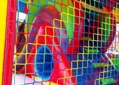 an inflatable bounce castle with colorful slides