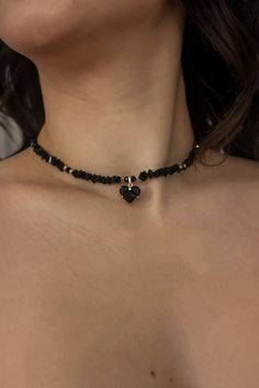 Featuring intricate details and a striking black heart necklace pendant, this choker exudes elegance and mystery. Embrace your dark side in style. Unleash your inner dark queen with our exquisite Black Crystal Choker. This Gothic Choker is embellished with a captivating black heart necklace charm, adding a touch of glamour to your look. Perfect for weddings, parties, or daily wear, this choker is a must-have for any fashion-forward individual. Beautiful black wedding crystal necklace and earring Adjustable Black Crystal Necklaces For Parties, Crystal Heart Beads Jewelry For Party, Black Heart Cut Jewelry For Wedding, Black Jewelry For Valentine's Day Party, Black Wedding Choker Jewelry, Black Crystal Jewelry With Black Beads, Crystal Necklace With Black Beads As A Gift, Elegant Black Heart Necklace For Parties, Black Heart Choker Necklace Gift